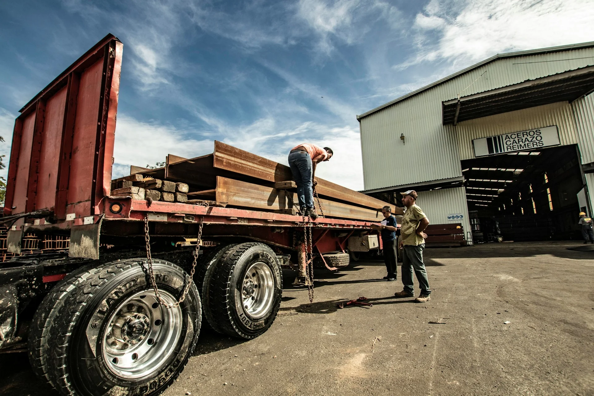 Delivery truck carrying steel materials to a construction project site