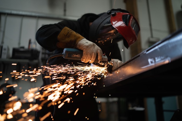 Steel beams and structural sections being cut to custom sizes
